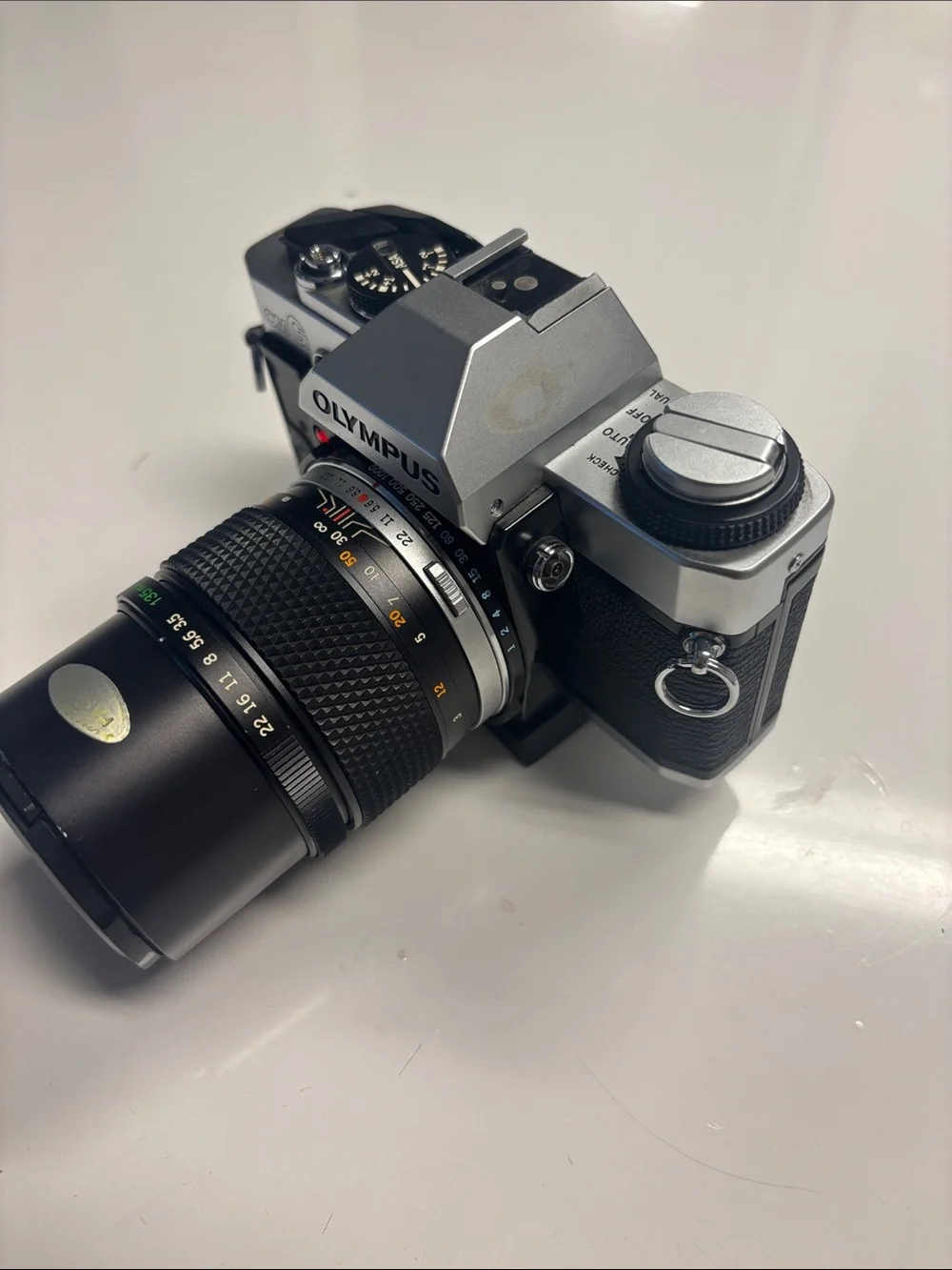 Olympus OM-G Film Camera + 135 mm lens.